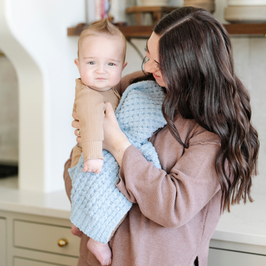Waffle knit mini blankets for babies in soft, cozy fabric, perfect for swaddling and keeping little ones warm.