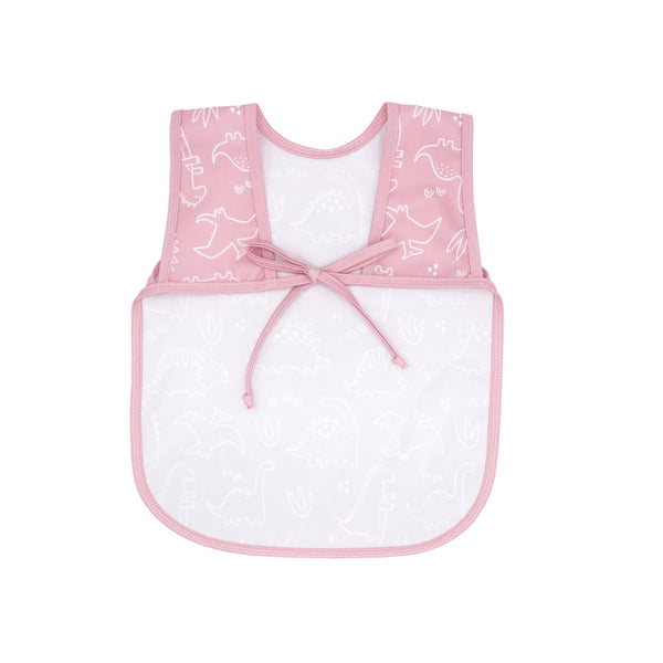 Blush Dino Friends Bapron for babies, featuring playful dinosaur design, angled view showcasing its unique style.
