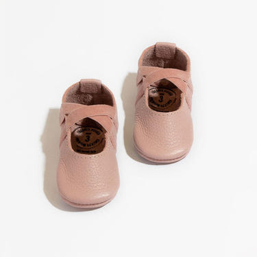 Blush ballet slipper baby shoe, perfect for little dancers and stylish infants.