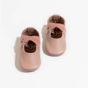 Blush ballet slipper baby shoe, perfect for little dancers and stylish infants.