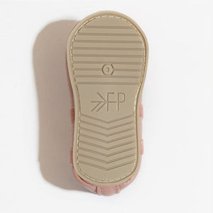 Blush ballet slipper baby shoe, angle view, perfect for tiny dancers and stylish infants.