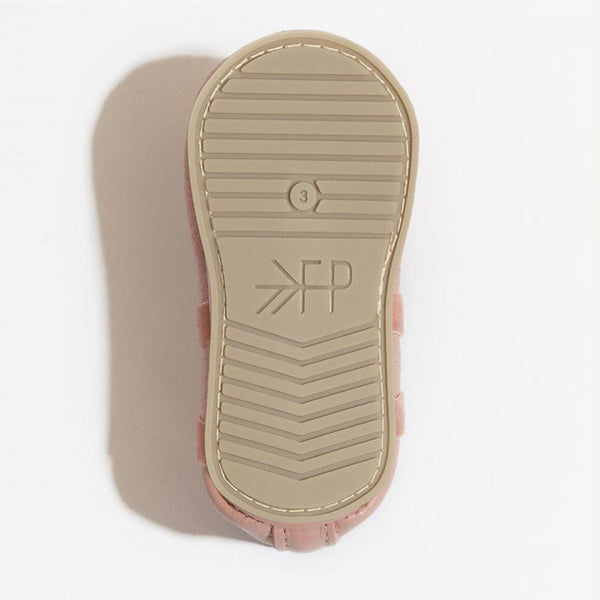 Blush ballet slipper baby shoe, angle view, perfect for tiny dancers and stylish infants.