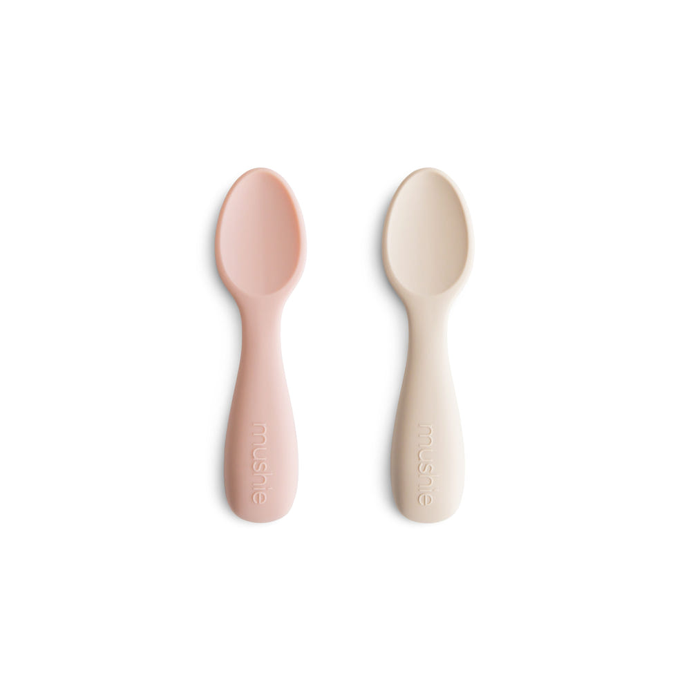 Silicone toddler starter spoons in vibrant colors for easy and safe feeding. Perfect for little hands.