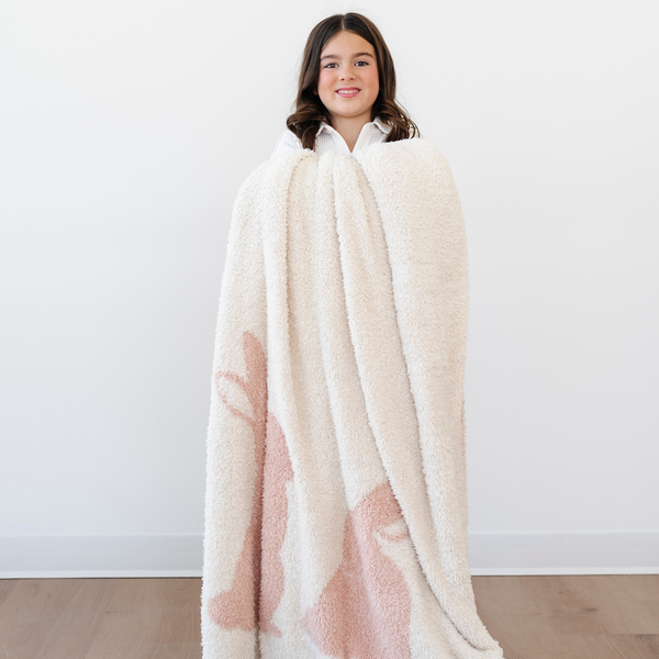 Double-layer Bamboni® toddler blankets in a cozy angle, perfect for swaddling and keeping your baby warm.
