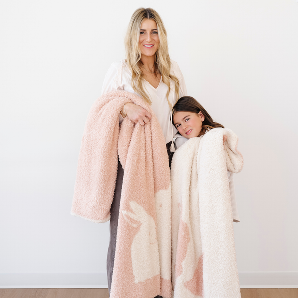 Double-layer Bamboni® toddler blankets in soft colors, perfect for swaddling and keeping babies cozy. Angle 27 view.