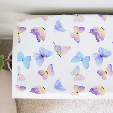 Butterfly changing pad cover for baby, soft and stylish, perfect for nursery decor and diaper changes.