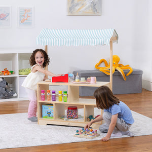 Holly Wooden Market Stand for kids' pretend play, showcasing a colorful display shelf at an angle.
