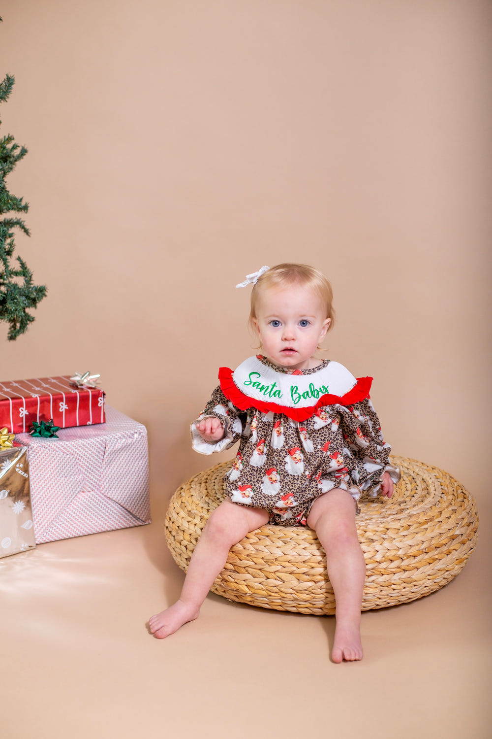 Santa baby smocked ruffle romper for infants, perfect for festive occasions and holiday celebrations.