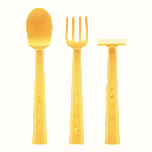 Colorful baby training utensils at an angle, perfect for encouraging self-feeding during mealtime.
