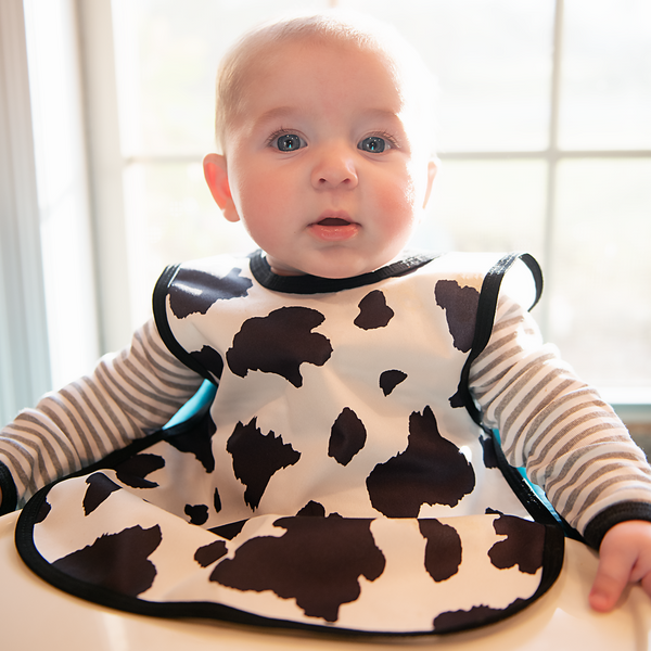 Cowhide Bapron on sale, angled view showcasing its unique design and functionality for babies.