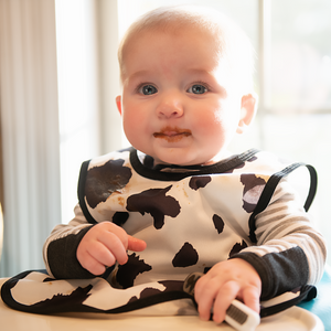 Cowhide Bapron on sale, angle view showcasing its unique design and functionality for babies.
