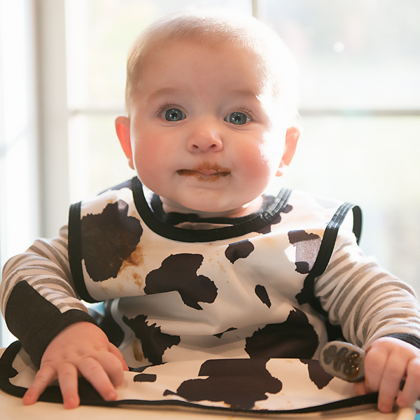 Cowhide Bapron on sale, angled view showcasing its unique design and functionality for babies.