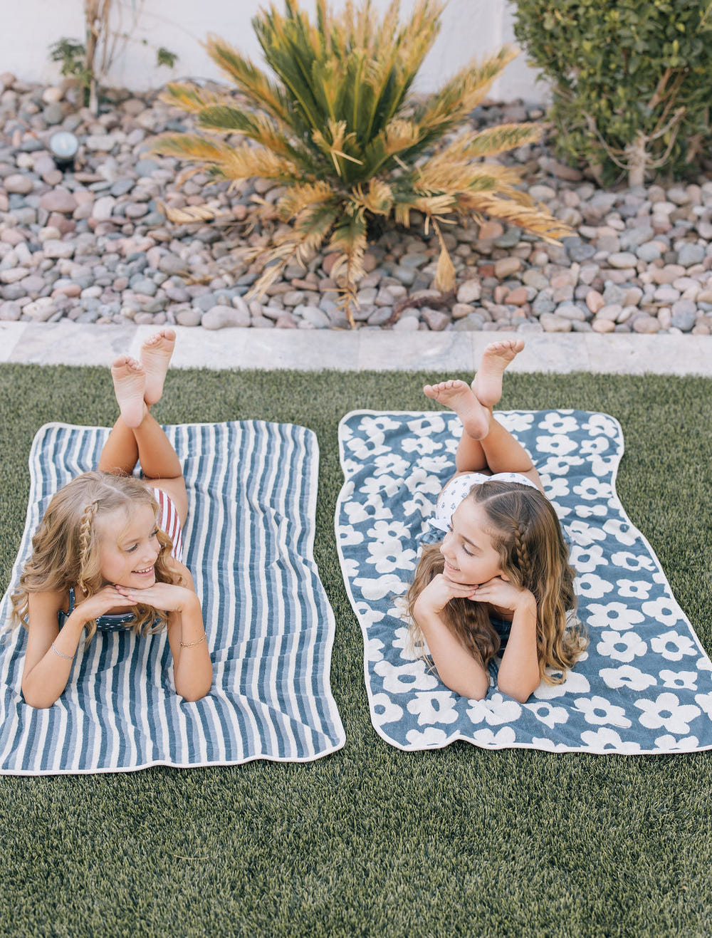 Floral organic cotton beach towel for babies, perfect for sunny days and gentle on delicate skin.
