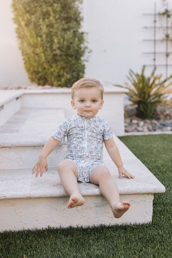 Palm Tree Zipper Swimsuit for babies, stylish and functional, shown from angle 3. Perfect for summer outings!