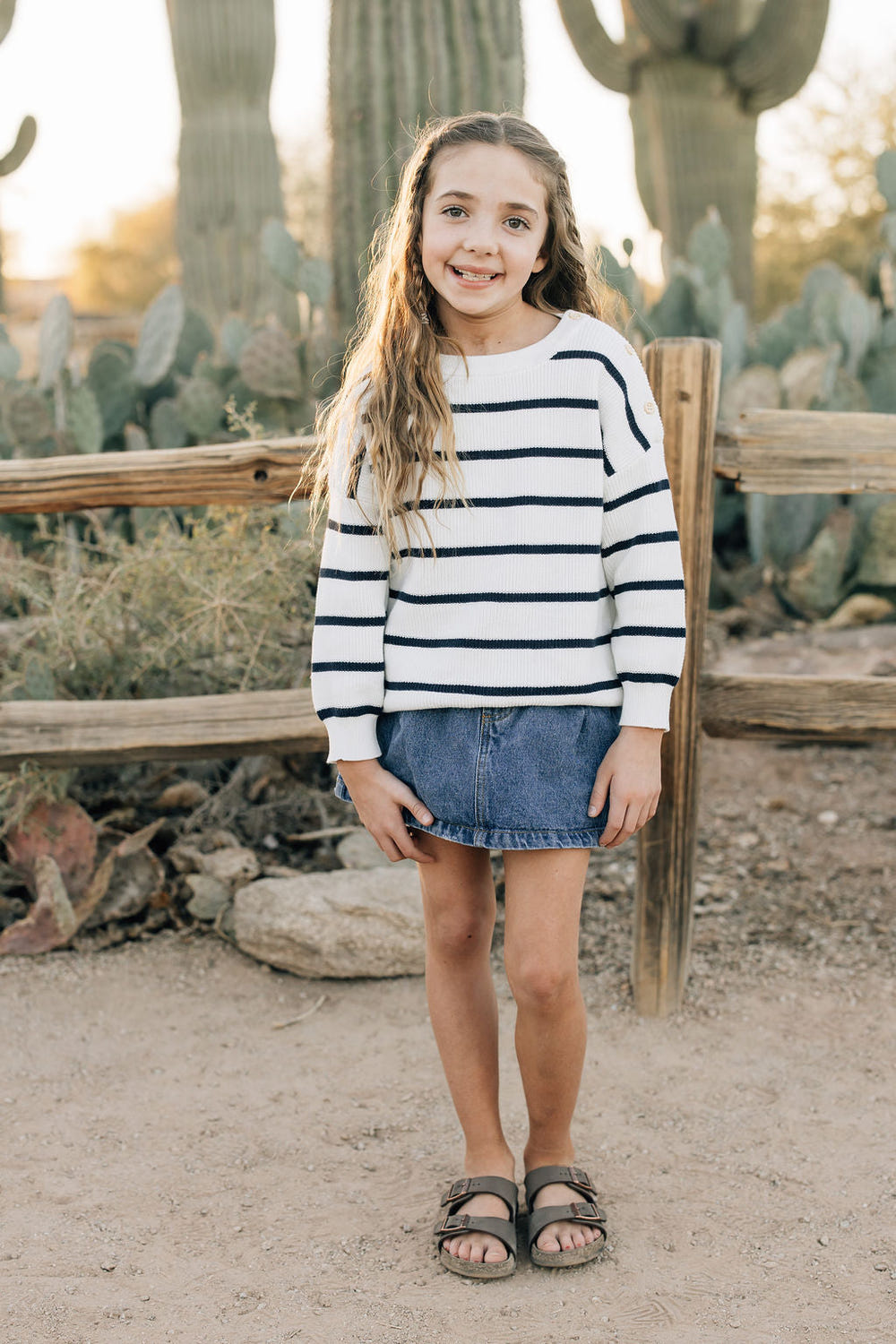 Navy stripe knit sweater for babies, perfect for nursery decor and cozy outfits.