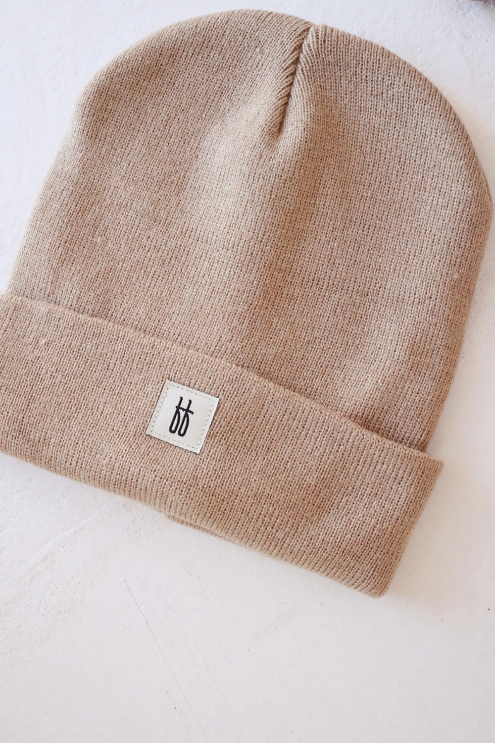 Taupe ff Knit Beanie for babies - stylish and cozy headwear for little ones.