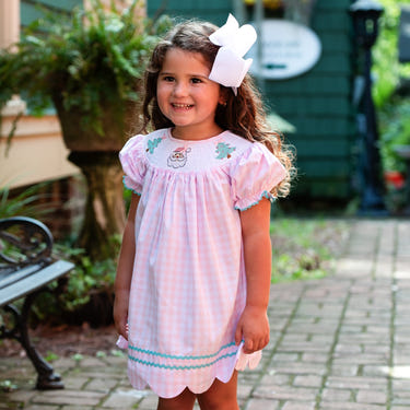 Smocked Christmas dress for girls, perfect holiday outfit with festive design and comfortable fit.