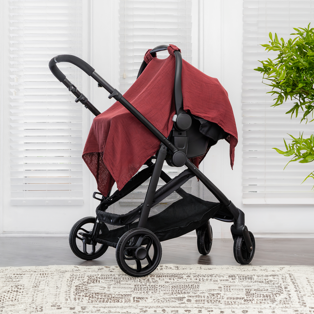 Baby car seat cover in wine color, stylish and protective for infants. Perfect for car seat safety and comfort.
