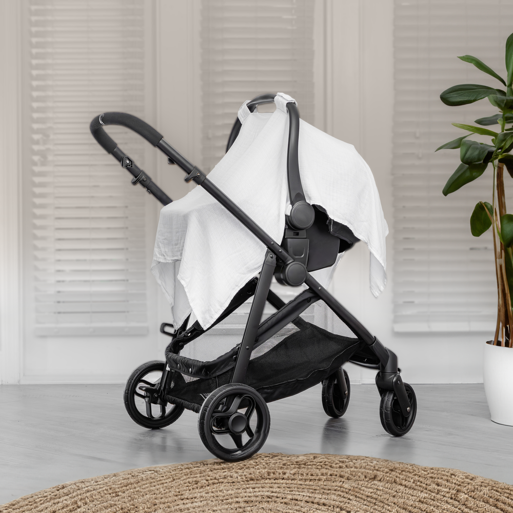 White baby car seat cover for added comfort and protection, perfect for stylish and safe travel.