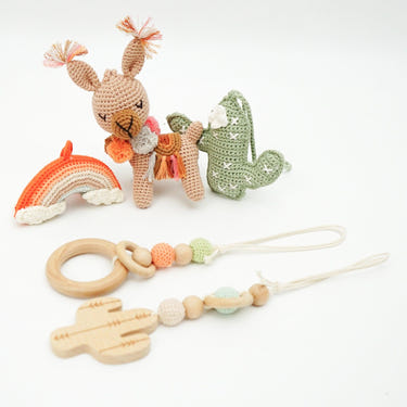 Handmade crochet toys for baby gym in boho desert style, perfect for stimulating play and development.