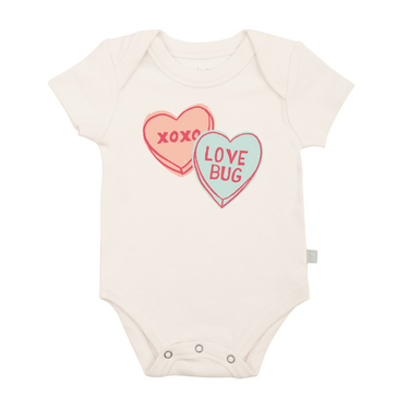 Short sleeve baby bodysuit featuring a cute candy hearts graphic design. Perfect for little ones!