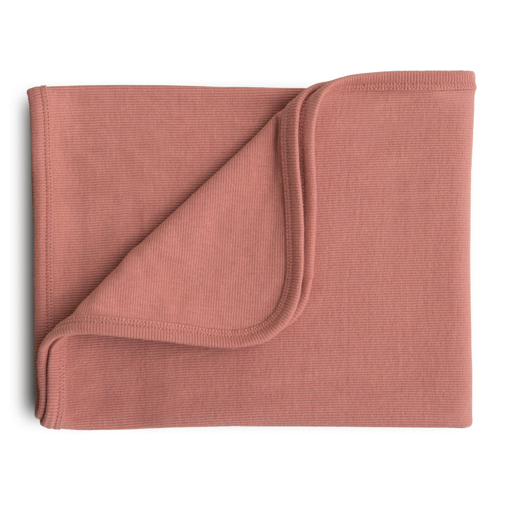 Soft ribbed baby blanket in soothing colors, perfect for keeping your little one cozy and warm.