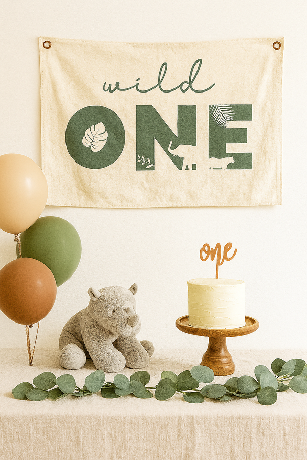 Wild One jungle-themed first birthday canvas banner, colorful wall art for celebrating baby's special day.