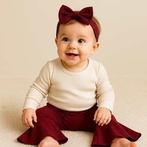 Burgundy baby bell bottoms from angle 2, perfect for stylish and comfortable infant outfits.