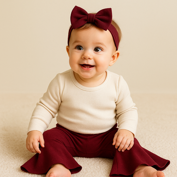 Burgundy baby bell bottoms from angle 2, perfect for stylish and comfortable infant outfits.