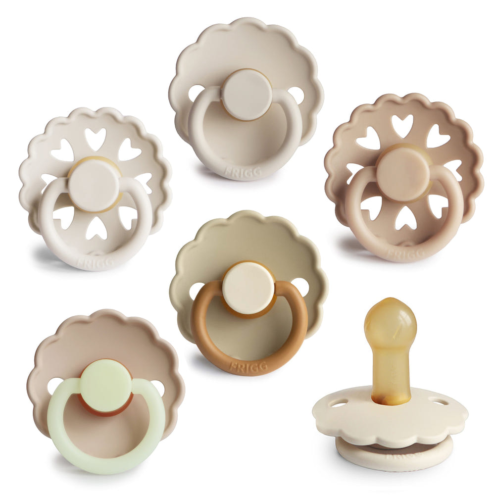 FRIGG Natural Rubber 6-Pack pacifiers in assorted colors for infants, promoting comfort and soothing.