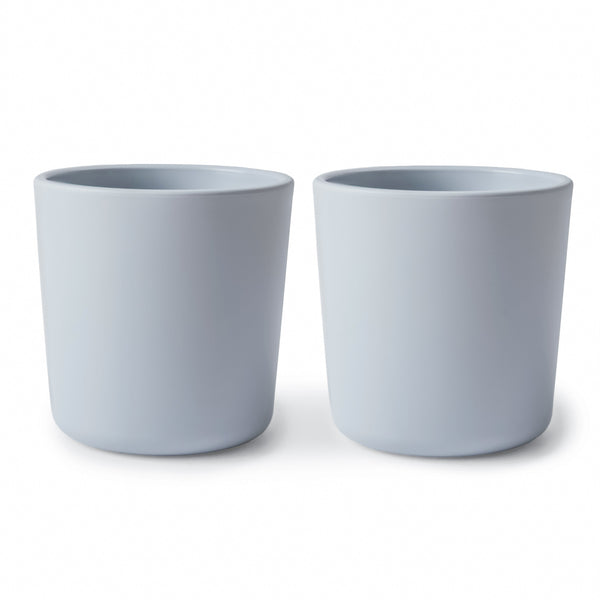 Colorful baby dinnerware cups at an angle, perfect for mealtime fun and easy handling for little hands.
