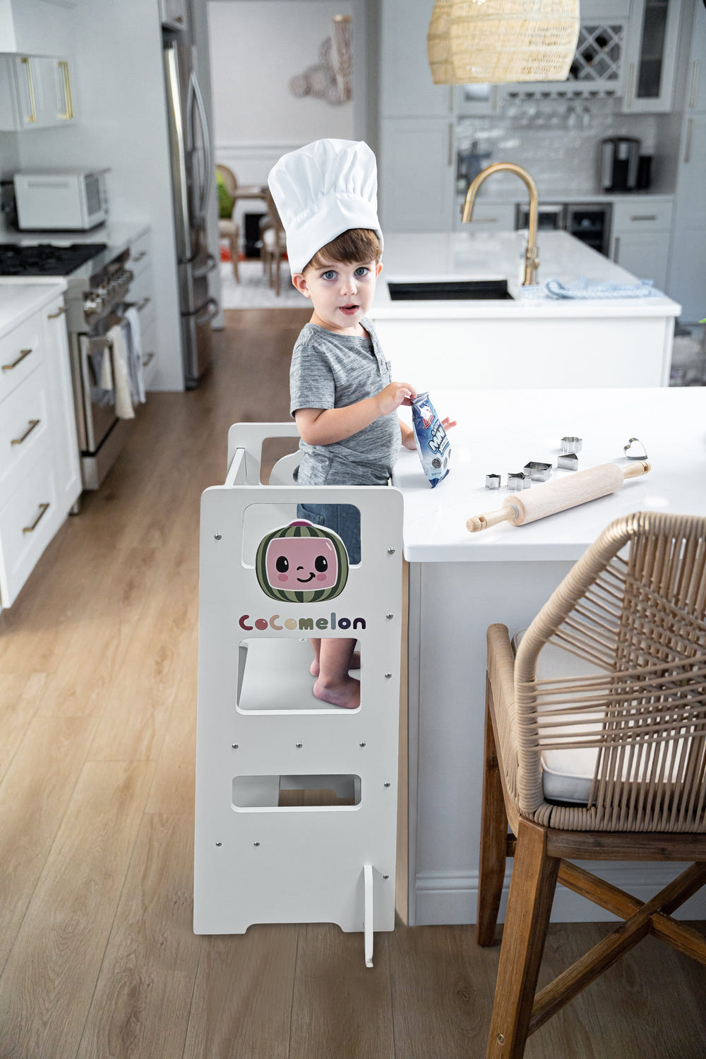 CocoMelon 3-in-1 Kitchen Tower for Kids: Step stool and chalkboard learning helper for indoor fun.