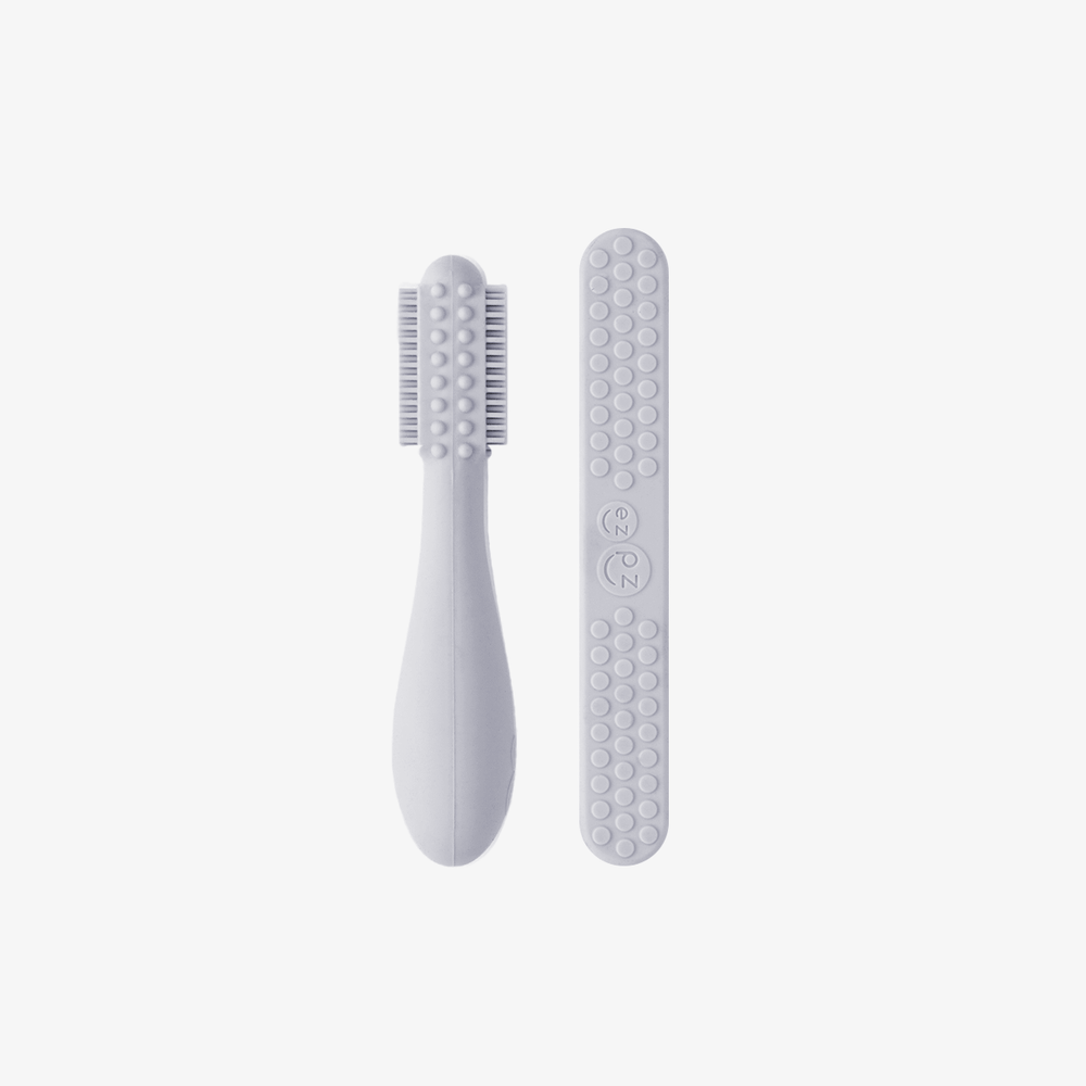 Baby-Led™ Toothbrush + Tongue Depressor in Pewter for effective oral care for infants.