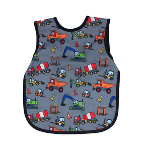 "Construction Zone Bapron for babies, featuring colorful construction vehicles, angled view showcasing design and functionality."