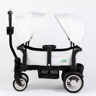 White Weekender stroller wagon with two canopies, perfect for outdoor adventures with your baby.