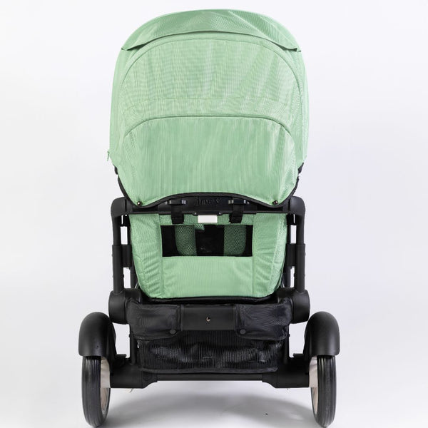 Stroller wagon "The Wagon - Spring Fern" shown at angle 4, featuring a stylish design and spacious seating for babies.