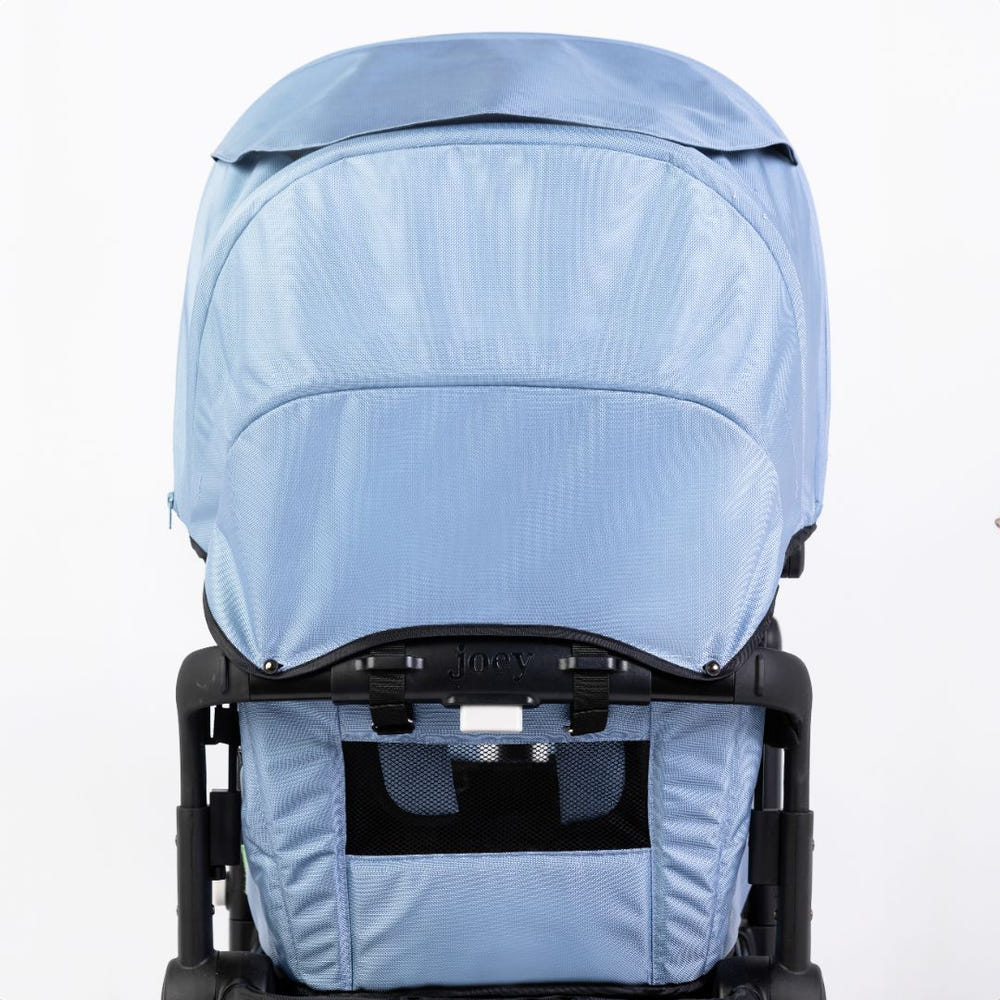 Seaside Blue stroller wagon with two canopies, perfect for outdoor adventures with your baby.
