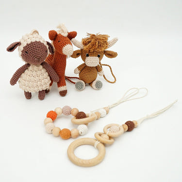 Handmade crochet toys for baby gym in farmhouse style, perfect for playtime and development.