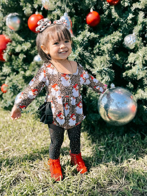 Leopard Santa ruffle romper for babies, festive holiday outfit, stylish and cute design, angle view.