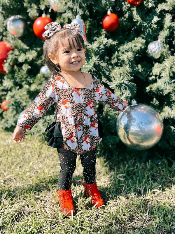 Leopard Santa ruffle romper for babies, festive holiday outfit, stylish and cute design, angle view.