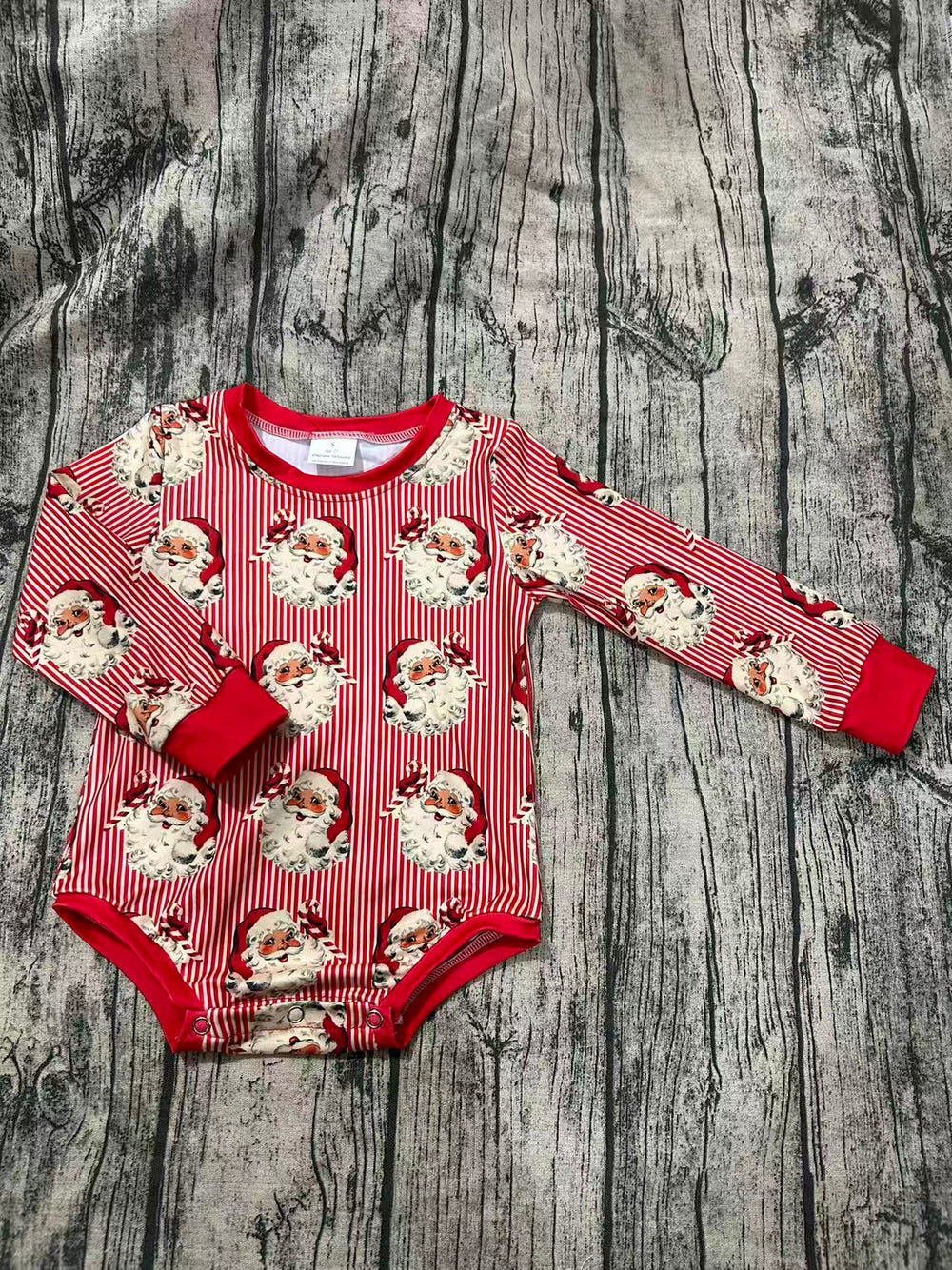 "Santa Stripe long sleeve Leo for babies - festive and cozy toy outfit for holiday fun."