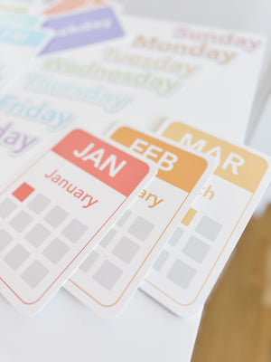 "Colorful calendar flashcards and magnets for early learning and sensory play, showcasing days, months, and seasons."