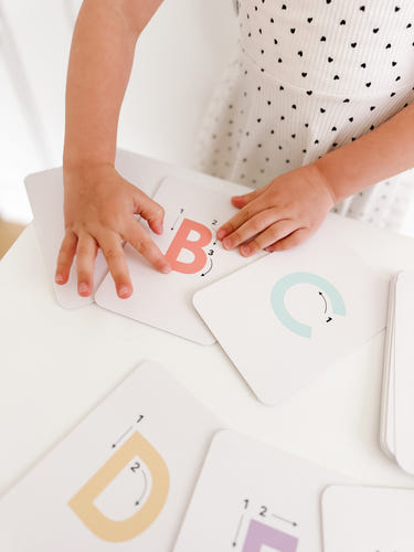 "Letter tracing flashcards for babies, promoting early literacy and fine motor skills in a safe learning environment."