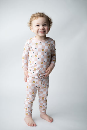 Checked Out Set sleepsuits and pyjamas for babies, featuring a stylish checked design.