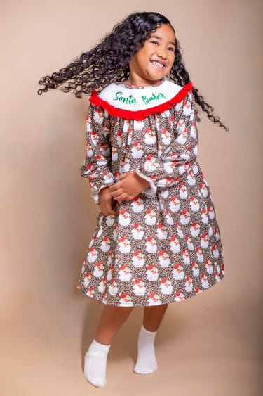 Santa baby smocked dress for infants, perfect for holiday celebrations and festive occasions.