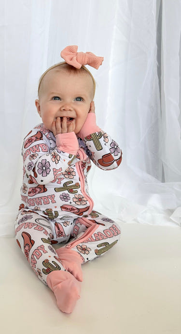 Howdy Darling Zippy: Cozy zip pajamas for babies, featuring soft fabric and adorable design for comfort and style.