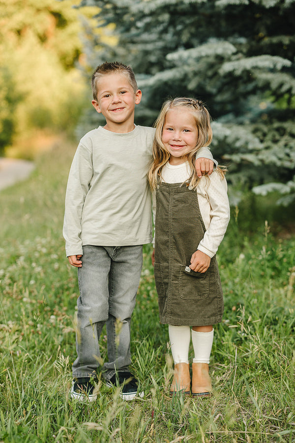 Green corduroy dress for babies, angle 3 view, perfect for stylish and comfortable outfits.