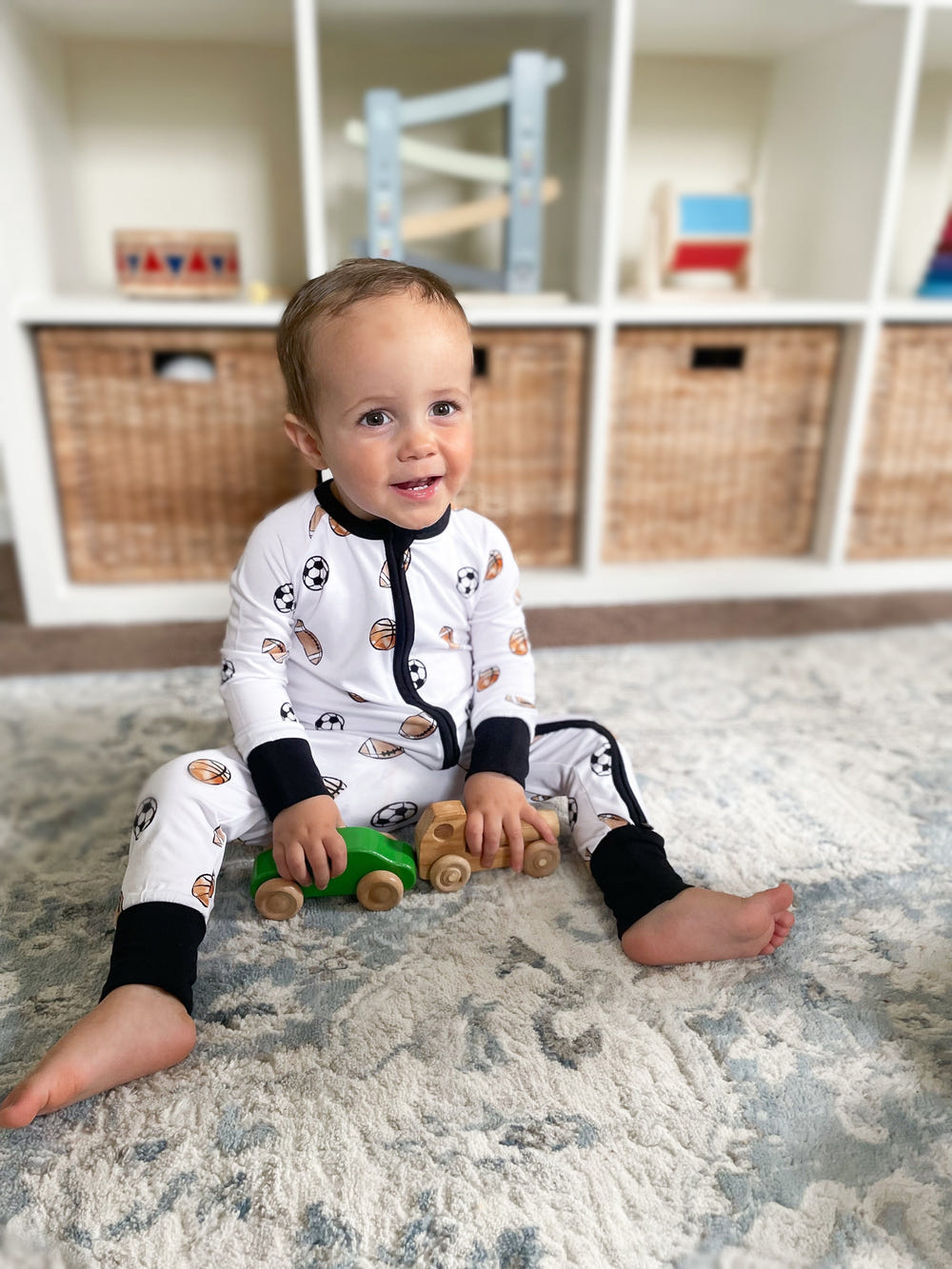 Dream Team Zippy zip pajamas for babies, featuring soft fabric and playful design for comfortable sleep.