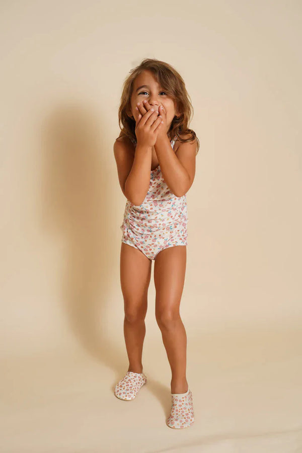 "Sunset Meadow swim shoes for babies, featuring a vibrant design, perfect for beach and pool adventures."