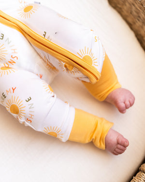 You Are My Sunshine Zipper Lounger for babies, cozy loungewear in a playful design, shown from angle 3.